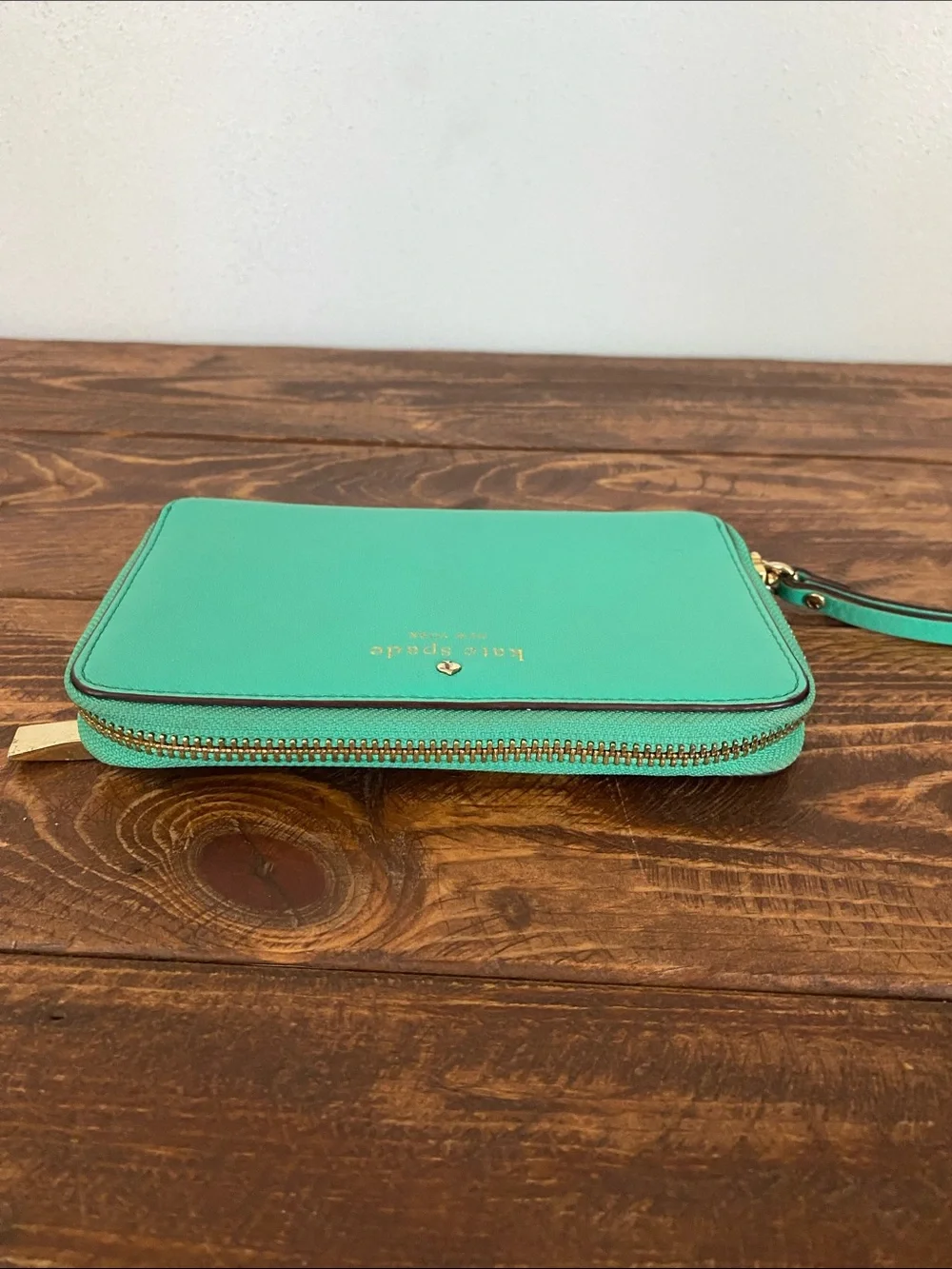 kate spade teal zip-around wristlet with strap